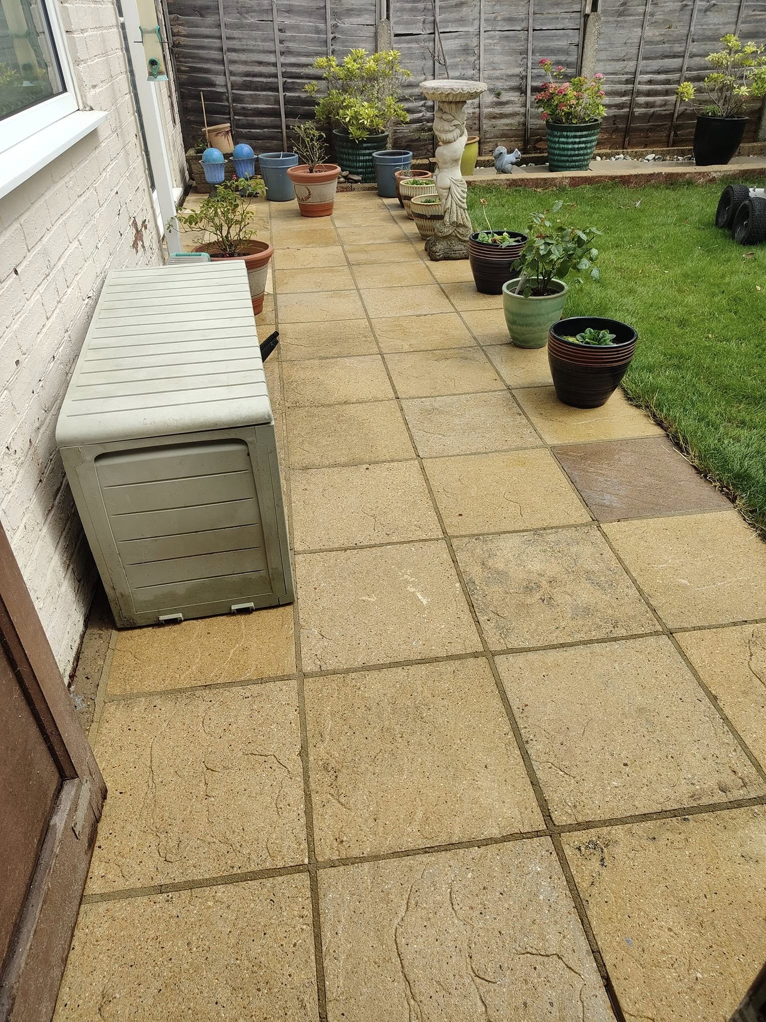 The same paving slabs clean after jet washing