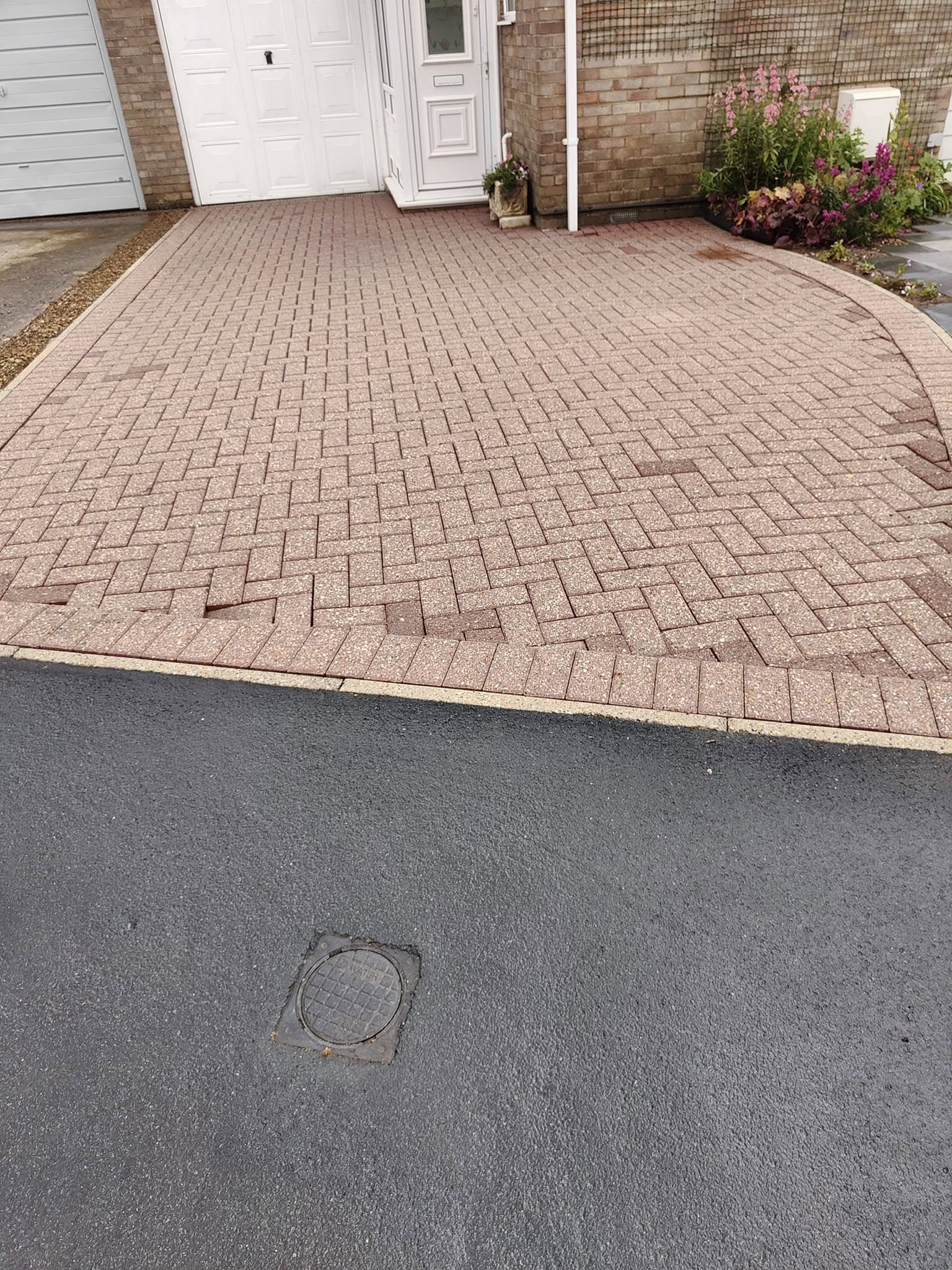 The same drive after cleaning, the red paving bright again