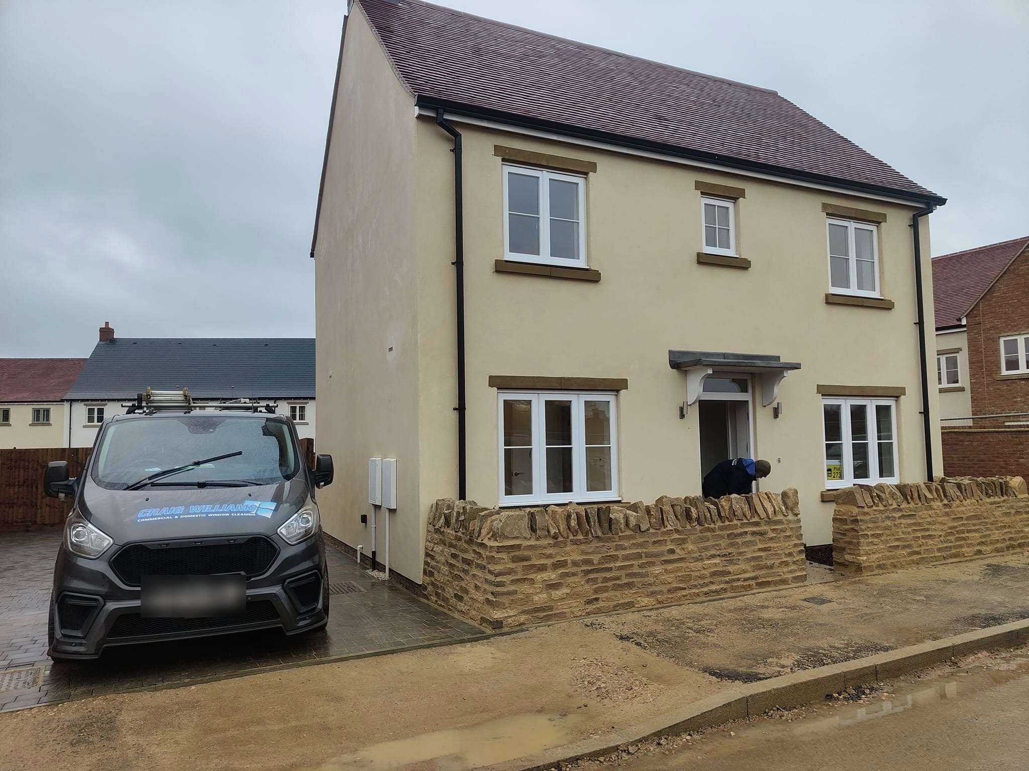 New-build house with the Craig Williams van on the drive