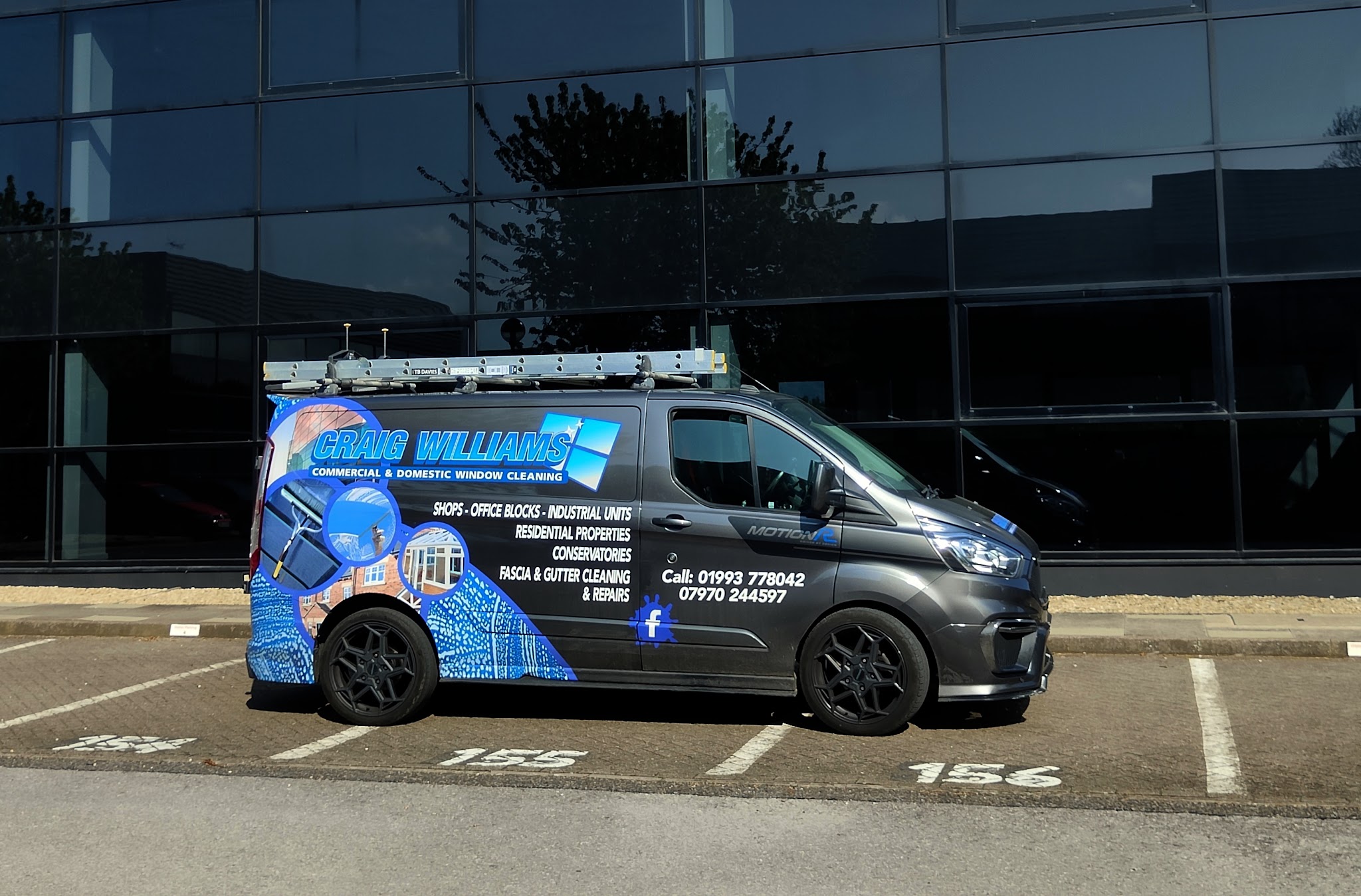 The Craig Williams van with its blue livery: commercial and domestic window cleaning